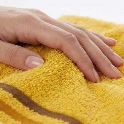 Coppia di asciugamani bagno viso+ospite senape con bordo a righe