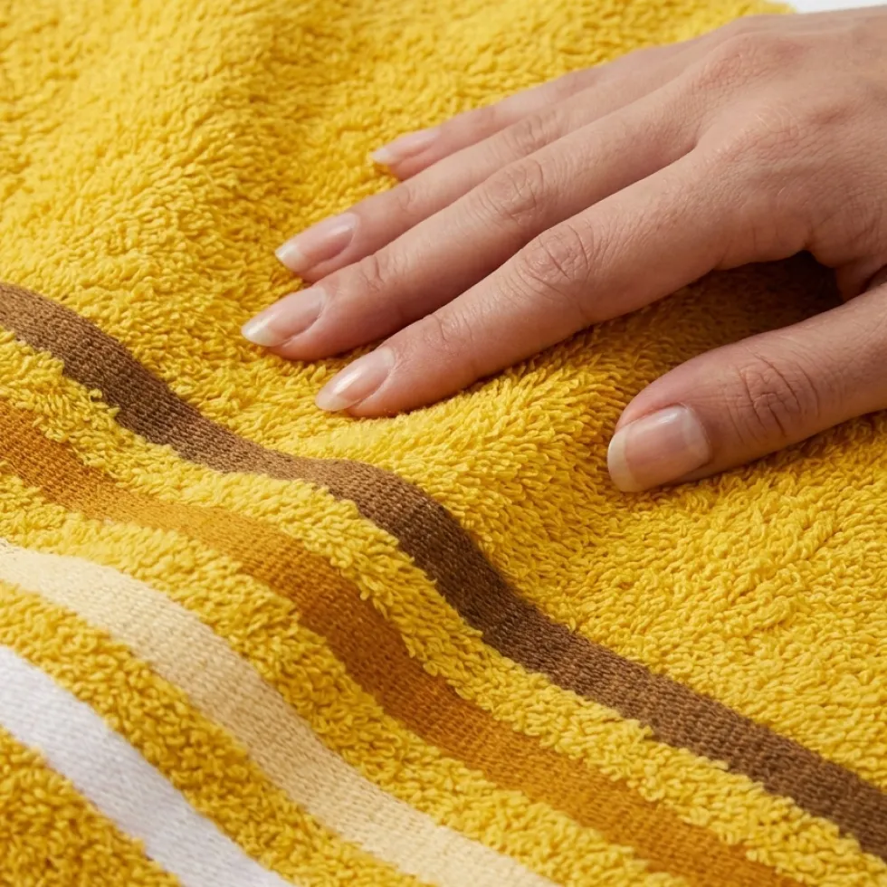 Coppia di asciugamani bagno viso+ospite senape con bordo a righe