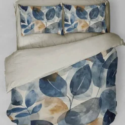 Copripiumino e federe matrimoniali in raso Astriel foliage blu e oro